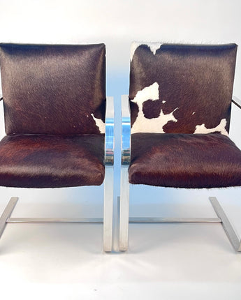 PAIR MIES VAN DE ROHE STYLE BRNO CHROME ARMCHAIRS IN COWHIDE